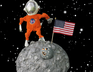 Starry night sky background with Astro-Knot-tie plush dog toy holding Luna Moon squeaky ball dog toy on the right side.