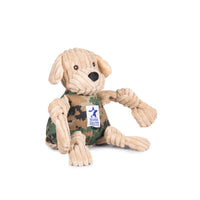 Side view of Warrior Canine Connection Tommy ll Lab Knottie- Yellow/Tan corduroy head and limbs, with camo body. Camo body has white Warrior Canine Connection logo on it. Floppy ears, black nose, and brown eyes. Thumbnail
