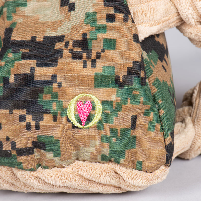Close up of HuggleHeart logo on camo body.
