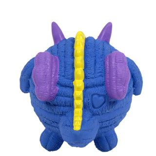 Back of squeaky ball shaped dragon dog toy: has blue scales, purple horns and wings, blue tail, and yellow spikes down the middle of the back.