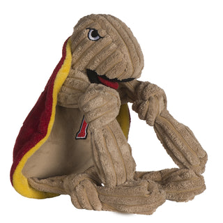 Side view of University of Maryland Testudo the Terrapin mascot plush dog toy with tan corduroy knotted limbs, tan corduroy head, tan belly with university logo on chest, black mouth open with red tongue, yellow inner shell, and red outer shell.