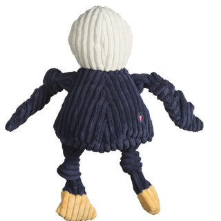 Back of Georgia Southern University Gus the eagle shaped plush dog toy: has white head, the body arms and legs are navy blue, has yellow feet, and is squeaky with knotted limbs.