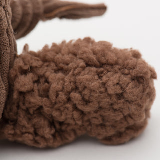 Close up of squirrel's fluffy brown fleece tail.