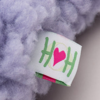 Close up image of HuggleHounds® tag on lavender bone.