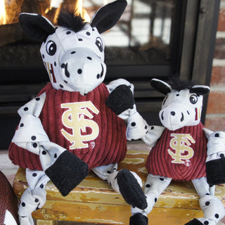 Set of two Florida State University Cimarron durable plush dog toys in large and small: has white fur with black polkadots, black hair, black inner-ear, black eyes white pupil, on the cheek there are three stripes, is wearing a burgundy shirt with the university logo, and is squeaky with knotted limbs.