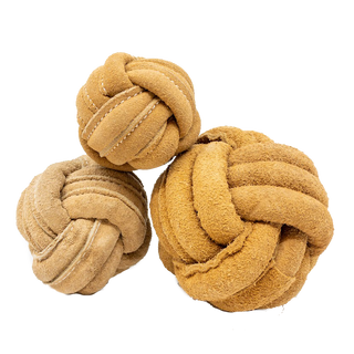 Three tan natural leather knotted ball dog toys in small, medium, and large.