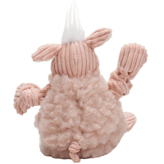 Back view of pig dog toy with pink fluffy HuggleFleece® body, white hair, white inner-ear, and is squeaky