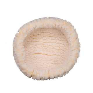View from above of XS sized natural colored HuggleFleece® dog/cat bed.