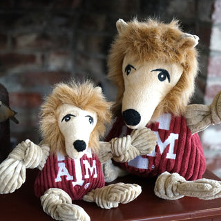 Set of two Texas A&M University durable plush corduroy dog toys sitting next to each other in sizes small and large.