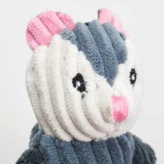 Close up of opossum to show corduroy details and embroidery details.