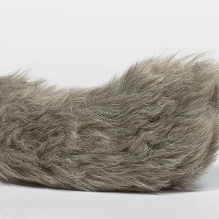 Close up image of squirrel's gray faux-fur tail.