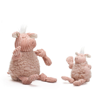 Two pink plush pigtoys with knottted arms and legs on a white background