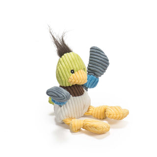 Side view of duck shaped durable plush corduroy dog toys. The duck has black hair, green head, black eyes, white pupils, yellow beak, brown neck, white body, blue and gray-blue knotted arms, and yellow knotted legs and feet. Size small.