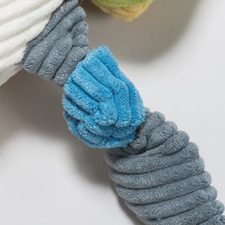 Close up of blue and grey knotted wing of Dilly duck durable plush corduroy dog toy.
