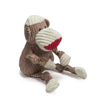 Side view of brown sock monkey durable plush corduroy dog toys with knotted limbs, red lips and white hands, feet, snout, and top of head. Size large.