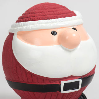 Close up view of squeaky ball shaped Santa: has black eyes, long white beard, and a santa suit. 