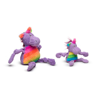 Side view of set of two unicorn shaped durable plush corduroy dog toys with squeakers in large and small: rainbow faux-fur horn and ears, purple head, purple knotted limbs, and rainbow faux-fur stomach.