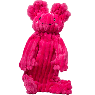 Large Axolotl shaped plush dog toy. Has bright magenta fur, with black eyes, white pupils, two ears, two arms, and legs. With a durable rope knotted skeleton. 