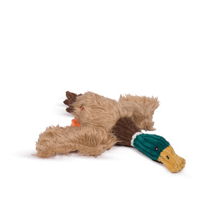 Duck shaped durable and plush dog toy. Has light-brown furred body, brown neck, green furred face, and a yellow beak. Alongside a rope knotted tough and durable skeleton. 