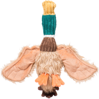 Bottom view of duck shaped plush dog toy. Has light-brown furred body, brown neck, green furred face, a yellow beak. orange feet, dark brown tail. Alongside a rope knotted tough and durable skeleton. 