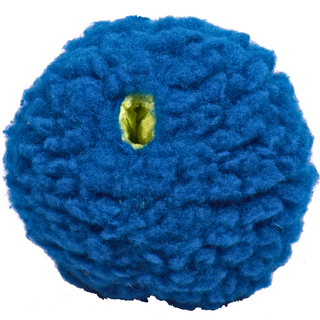 Close-up of the large blue treat-trapper ball, showing one of the three green holes designed to hide treats inside for your dog to discover.