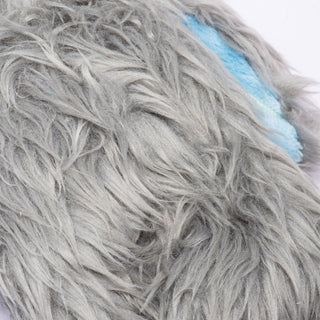 Close-up of Snobro's long gray faux-fur detailing, showing texture and softness of the toy's outer material.
