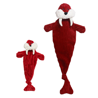 Two red plush toy seals with white faux-fur faces and black noses, shown on a plain white background. One seal is small and one is large, both in a ribbed red fabric with floppy arms and tails.