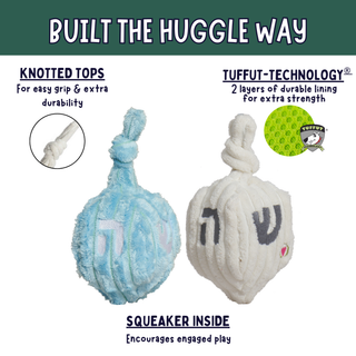 Two plush dog toys shaped like dreidels, one light blue and one white, with Hebrew letters on the front. The image includes marketing text and callouts about knotted tops, tuffut-technology lining, and a squeaker inside, on a white background with a dark green header.