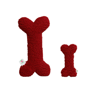 Two red bone-shaped plush dog toys with a sherpa-like textured fabric, shown on a plain white background. One toy is large and the other is small, both featuring small white tags near the base.