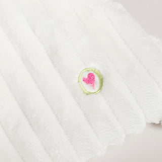 Close-up of the HuggleHeart embroidered heart on the back of the Snowman HuggleFlatties toy.
