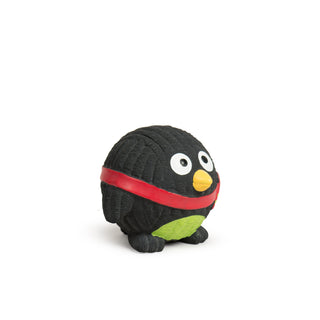 Side view of black Ruff-Tex penguin toy with red scarf and yellow beak

