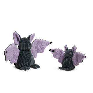 Two Baxter Bat plush toys in different sizes sitting side by side, each with purple wings and black corduroy bodies.
