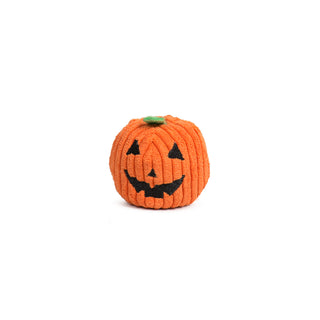 Studio shot of Pumpkin Wee Hugglea® Ball standing upright on white background.
