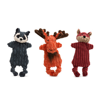 Set of three corduroy plush dog toys with minimal stuffing: Gray raccoon with white face, black around eyes and inner ears, black embroidered nose and facial details, and brown embroidered eyes; orange moose with brown inner ears and antlers, brown hair tuft for beard, and black embroidered facial details; maroon fox with tan bottom half of face and inner ears, and black embroidered facial details. All three have minimal stuffing, knotted legs, crinkle paper, and squeaker in the head.