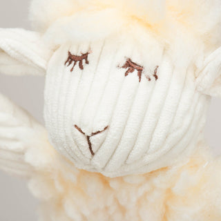 Close up of brown embroidery facial details on Louise Lamb Fluffer Long & Lovelie™.