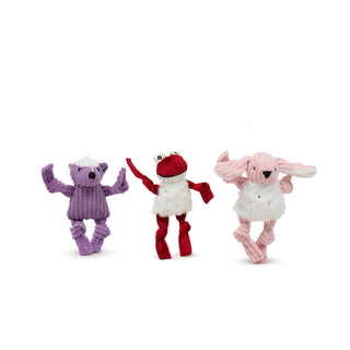 Picture of a purple corduroy plush skunk, a red velveteen frog and a pink corduroy plush bunny very small (wee) dog toys.  They are sold as a set called Wee Charmers 3 pack.  Both the frog and the bunny have white plush bellies with silver flecks. 