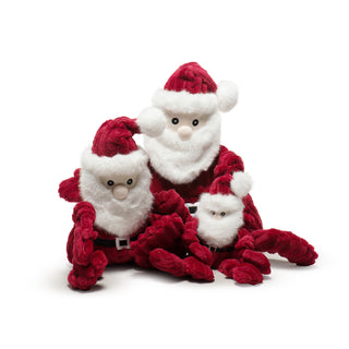 Set of three St. Nick plush dog toys with knotted limbs: all have red wide-wale corduroy bodies and hat, black and silver belt, white faux-fur beard and hat accents, pale skin tone face with embroidered black eyes.