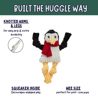 A knotted penguin dog toy with black arms and legs, a white body, yellow legs, and a red scarf, shown on a white background with marketing text and a circular inset of a knotted arm detail.