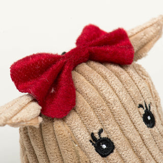 Close up of reindeer head's red bow to show fabric textures and embroidery details.