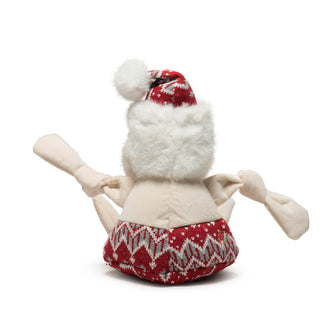 Back view of large Beach Bum Santa with pale skin tone back and knotted arms, red nordic print bathing suit and hat, fluffy white back of head and trim on hat with pouf ball.