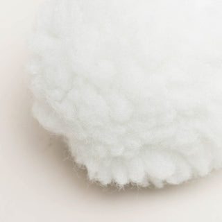 Close up of white HuggleFleece® plush snowball to show texture.