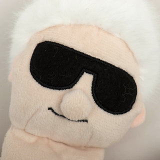 Close up of Mrs. C plush dog toy to show details in embroidered face.