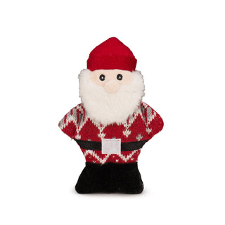 Santa plush cookie dog toy wearing red nordic print sweater, black shoes and belt, silver belt buckle, red hat, fluffy white beard covering half of his pale skin tone face showing black embroidered eyes.