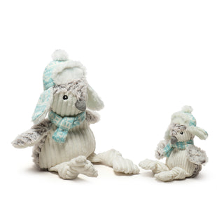 Set of two Ursa Penguin Knottie® plush dog toys: white corduroy stomach, face inside of wings, and knotted legs, fluffy gray back, head, and wings, aqua and white Nordic print scarf and trapper hat with fluffy white fabric on the inside of hat and pouf ball on top.