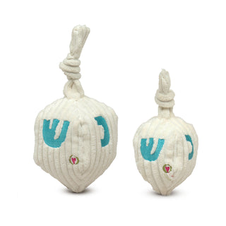 Set of two plush dreidel dog toys in large and small: white corduroy dreidel with knotted handle and blue embroidered Hebrew characters on four sides.