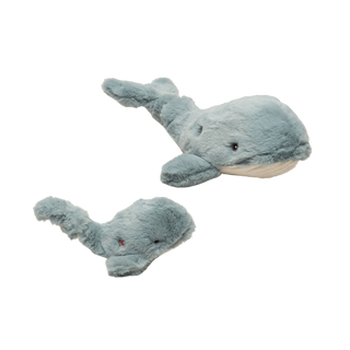 Set of two whale durable plush dog toys in large and small with gray fuzzy faux-fur body, knotted tail, embroidered brown and black eyes, and white corduroy belly.