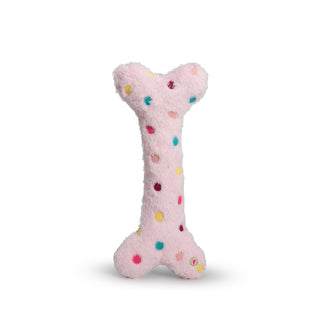 Other side of durable plush dog toy bone with light pink faux-fur and multicolored polka dots.