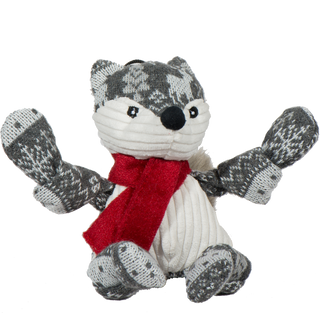 Festive fox shaped durable plush dog toy: fur has a gray and white Christmas sweater pattern, black nose, black eyes, white pupils, has a white face, and stomach, wearing a red scarf, furry gray tail, and is squeaky with knotted limbs.