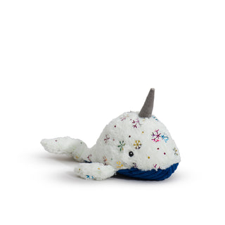 Large narwhal with white faux-fur with shiny metallic rainbow snowflake design, gray horn, blue corduroy belly, and a knotted tail.