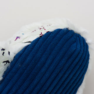 Close up view of narwhal plush dog toy blue corduroy belly. 